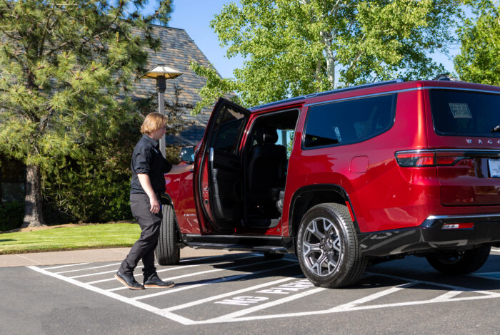 man opening door of SUV