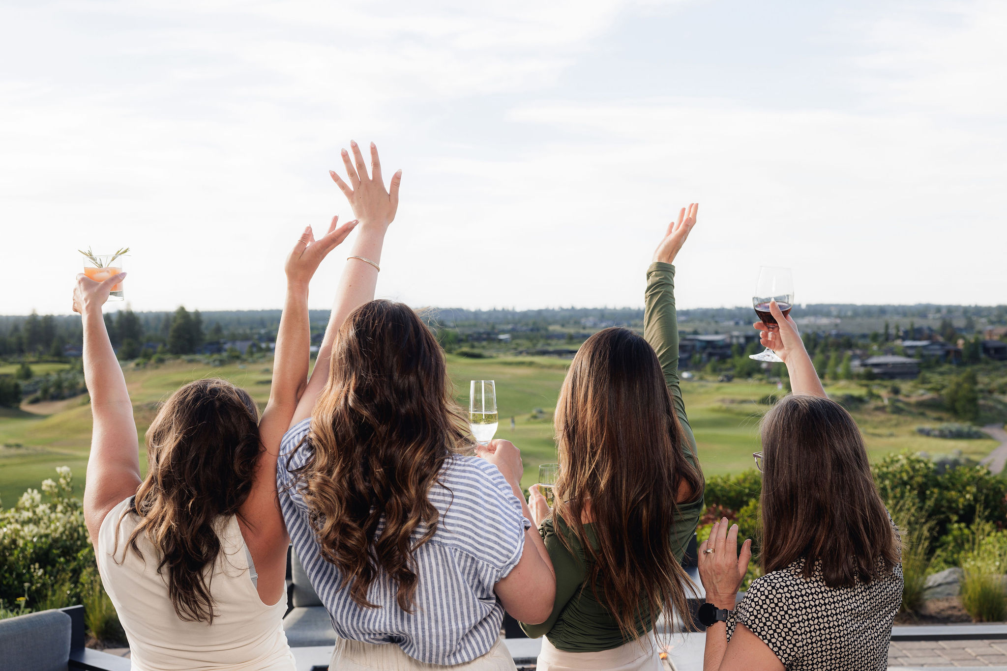 Women Toasting with view of golf course