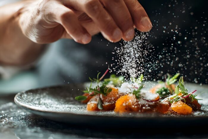Chef plating dinner